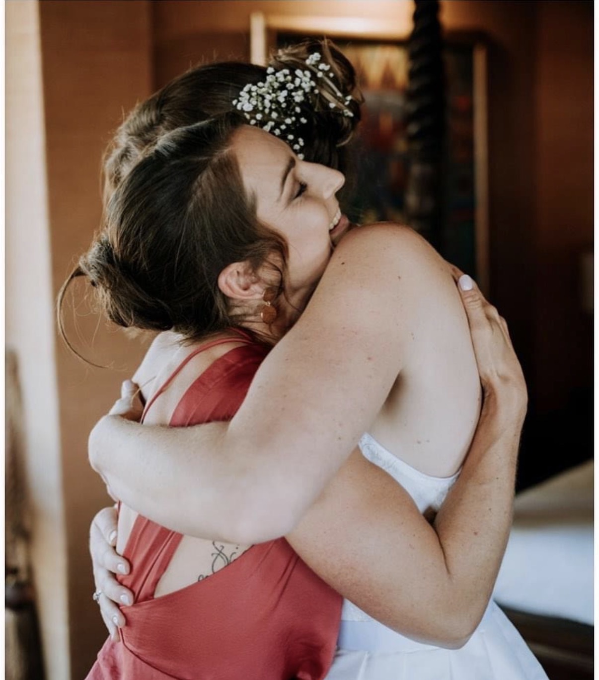 Liz hugging a happy bride on her wedding day